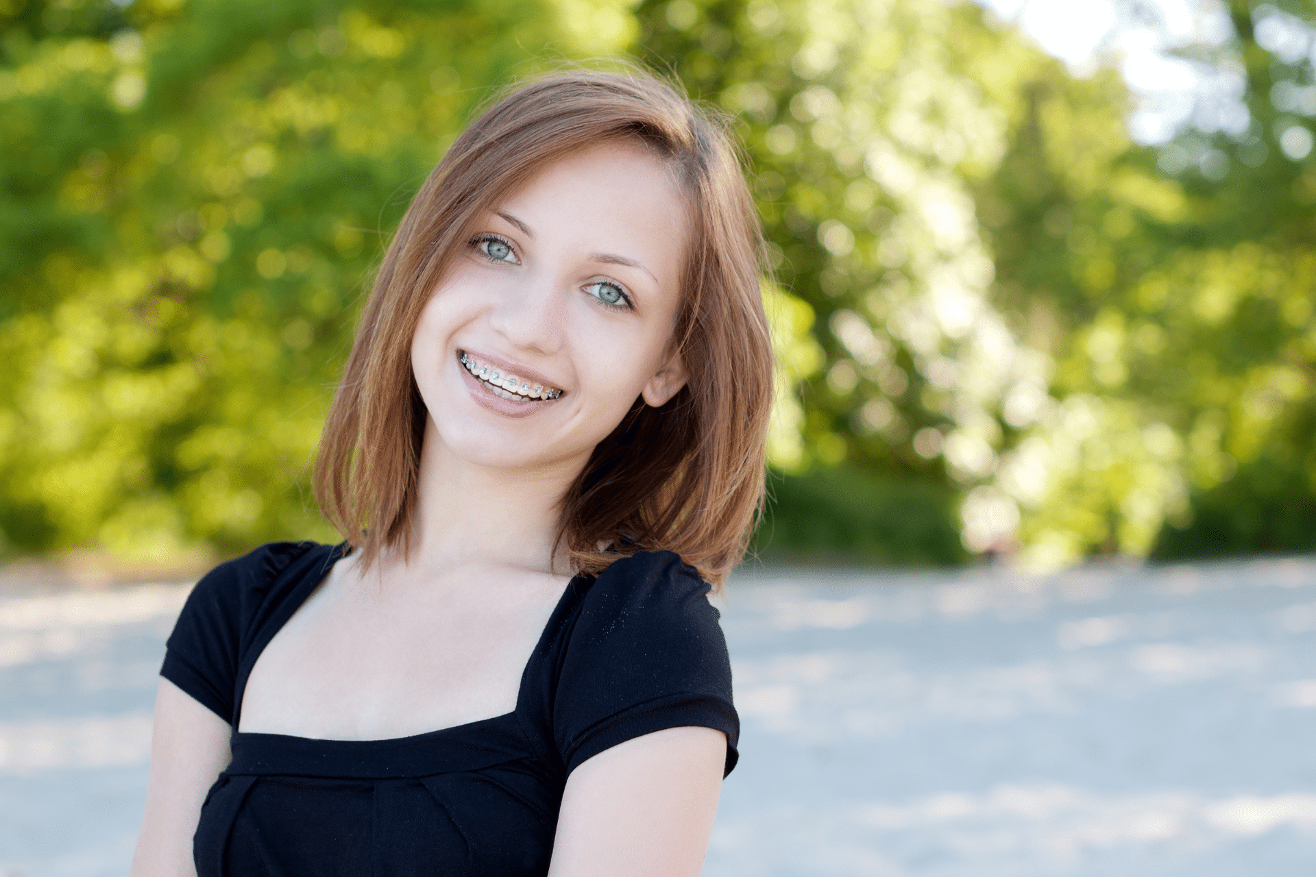 Teen with braces learning what affects orthodontic treatment time in Downers Grove IL